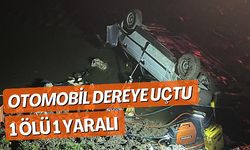 OTOMOBİL DEREYE UÇTU; 1 ÖLÜ 1 YARALI