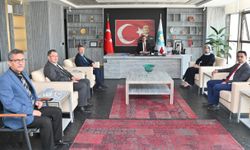 MCBÜ Rektörü Rana Kibar'dan Başkan Ferdi Zeyrek'e hayırlı olsun ziyareti