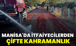 Yangını söndüren itfaiye erleri, Manisa'da yola saçılan domatesleri temizledi